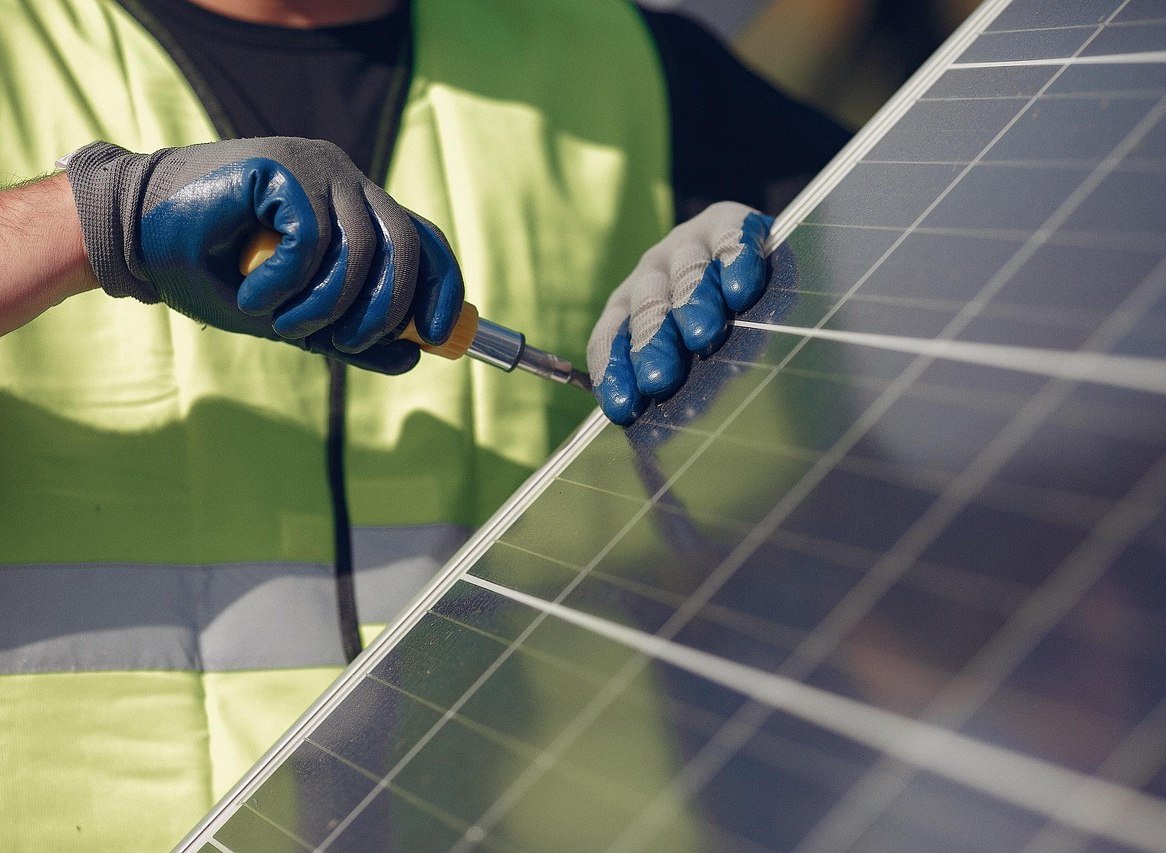 Workers installing solar panels