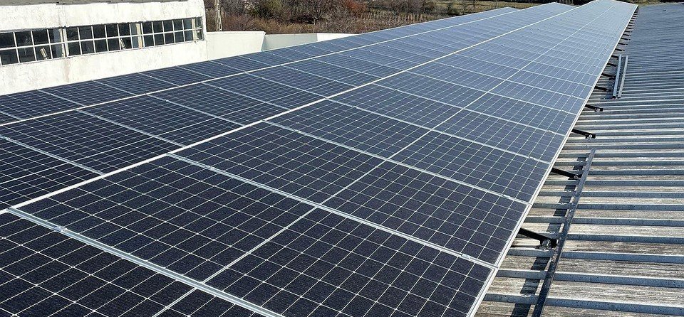 Technician installing a solar panel