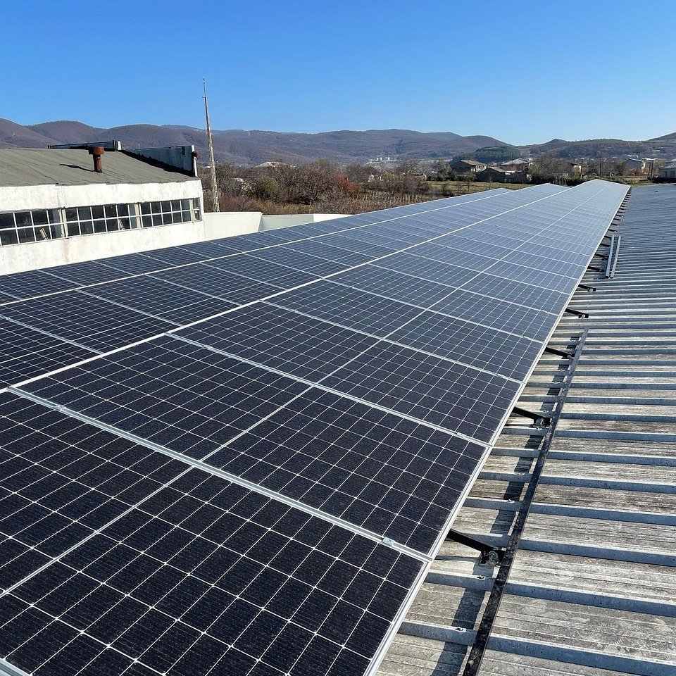 Technician installing a solar panel